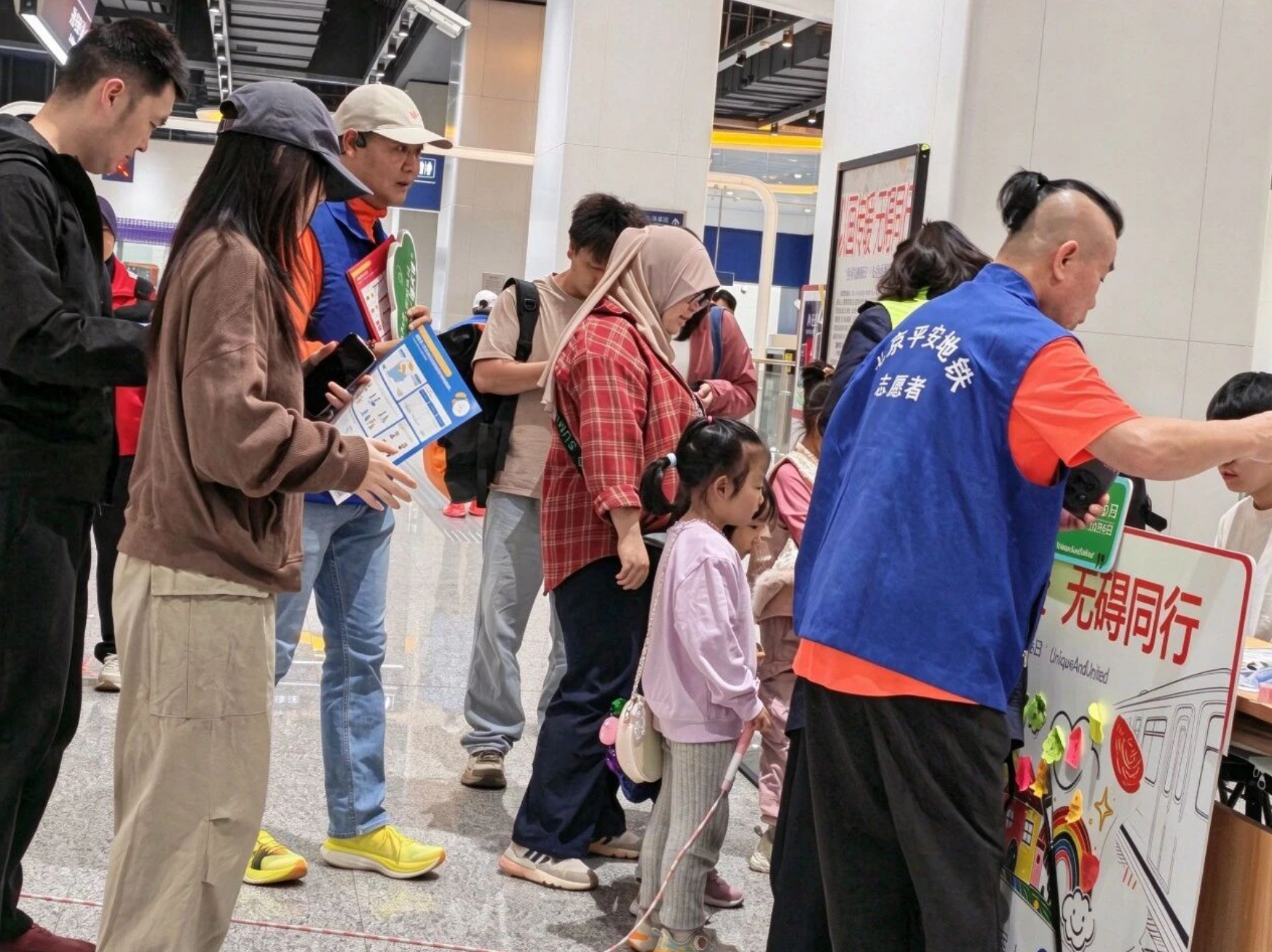 Volunteers and community members taking part in an accessibility awareness activity.