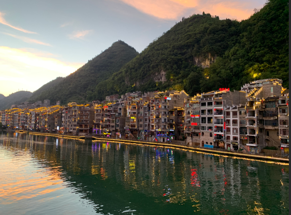 Life & Passions Travel photograph of a riverside town at dusk